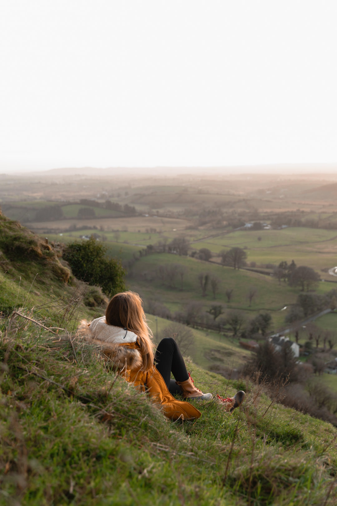 sitting in grass overlooking ireland